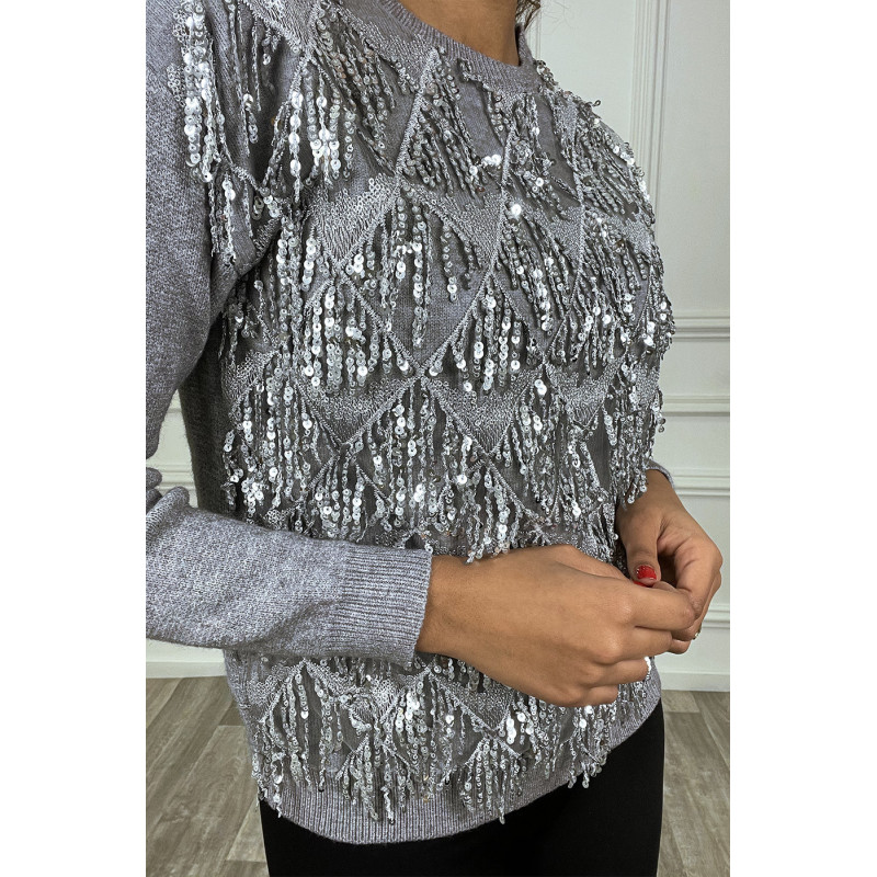 Pull gris à frange en sequin sur le devant. Pull femme