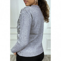 Pull gris à frange en sequin sur le devant. Pull femme