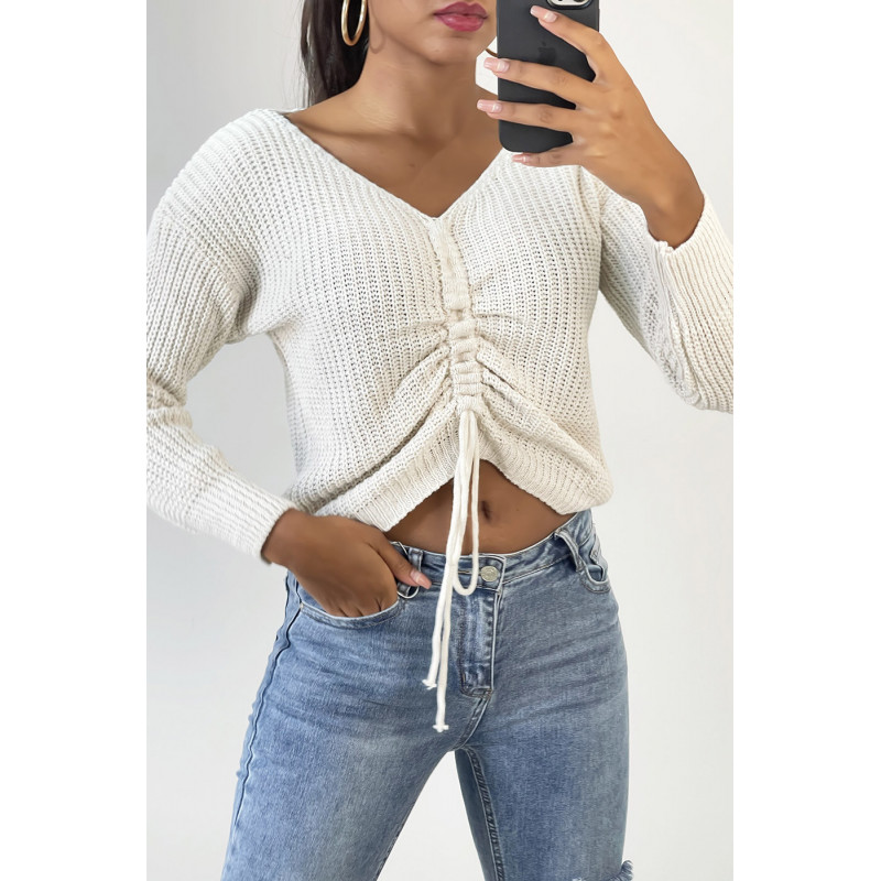 Pull beige col V avec lacet réglable à l'avant