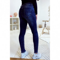 Jeans slim bleu foncé délave et déchiré aux genoux A1016