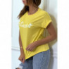 T-shirt jaune avec écriture "pincesse" et manches retroussées