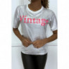 T-shirt blanc col rond avec motif irisé argenté et inscription "Vintage" fushia