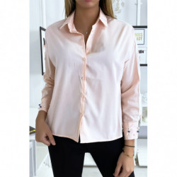 Chemise rose à perles sur...