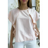 Blouse rose à volant avec trois boutons à l'épaules - 1