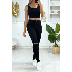 Jeans slim en noir déchiré aux genoux avec poches à l'arrière - 1